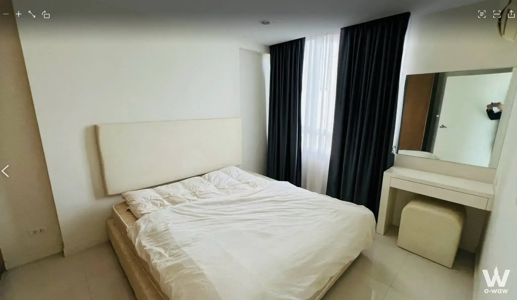 ELEMENTS SRINAGARINDRA two-bed condo for sale featuring a modern bedroom with cream headboard, vanity desk, and neutral