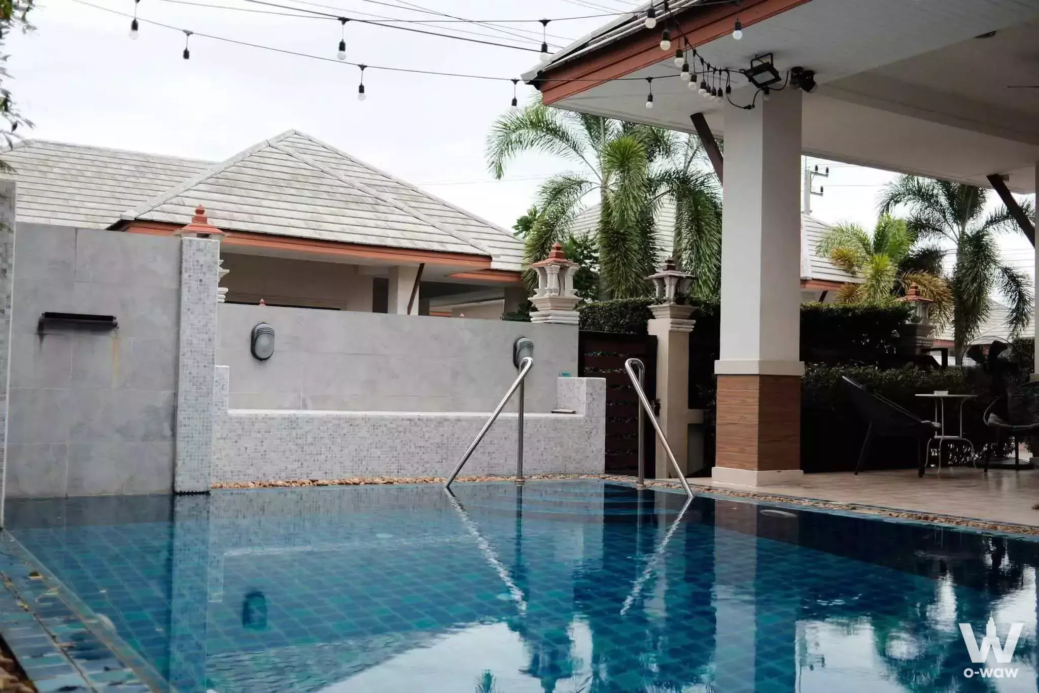 Private pool with blue mosaic tiles and lounge chairs at this 3-bed rental in Baan Dusit Pattaya View