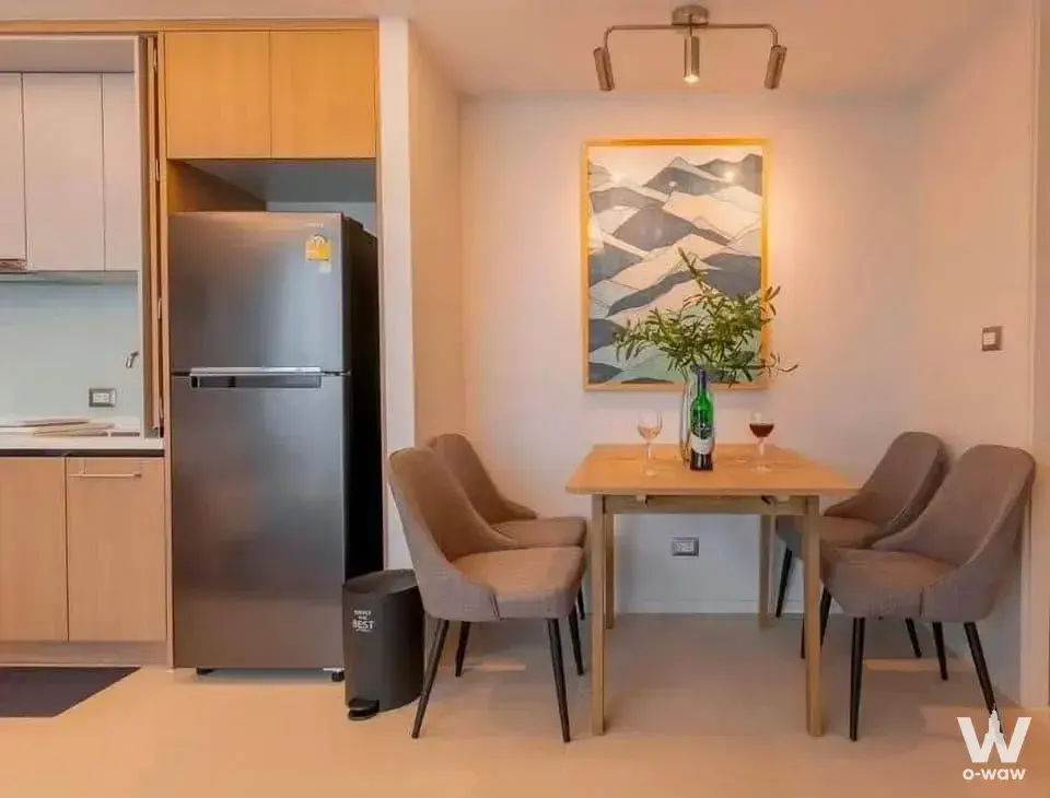 1-bed condo for rent in Circle Condominium with light-wood dining table and modern kitchen