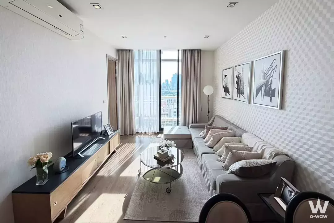 Spacious Park Origin Phrom Phong living room featuring sectional sofa and city skyline view