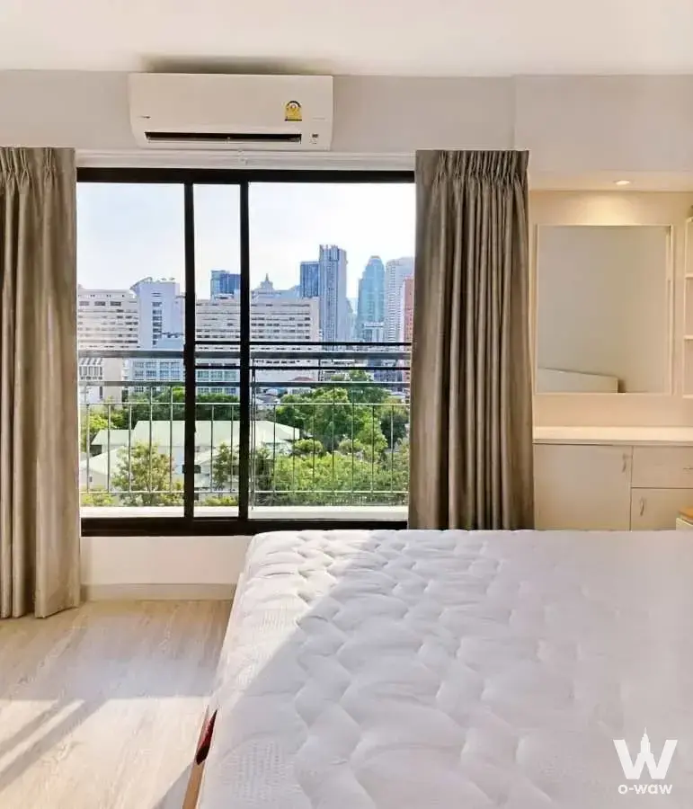 Unfurnished bedroom with bare mattress and built-in vanity in Liberty Park 2 2-bed condo for sale