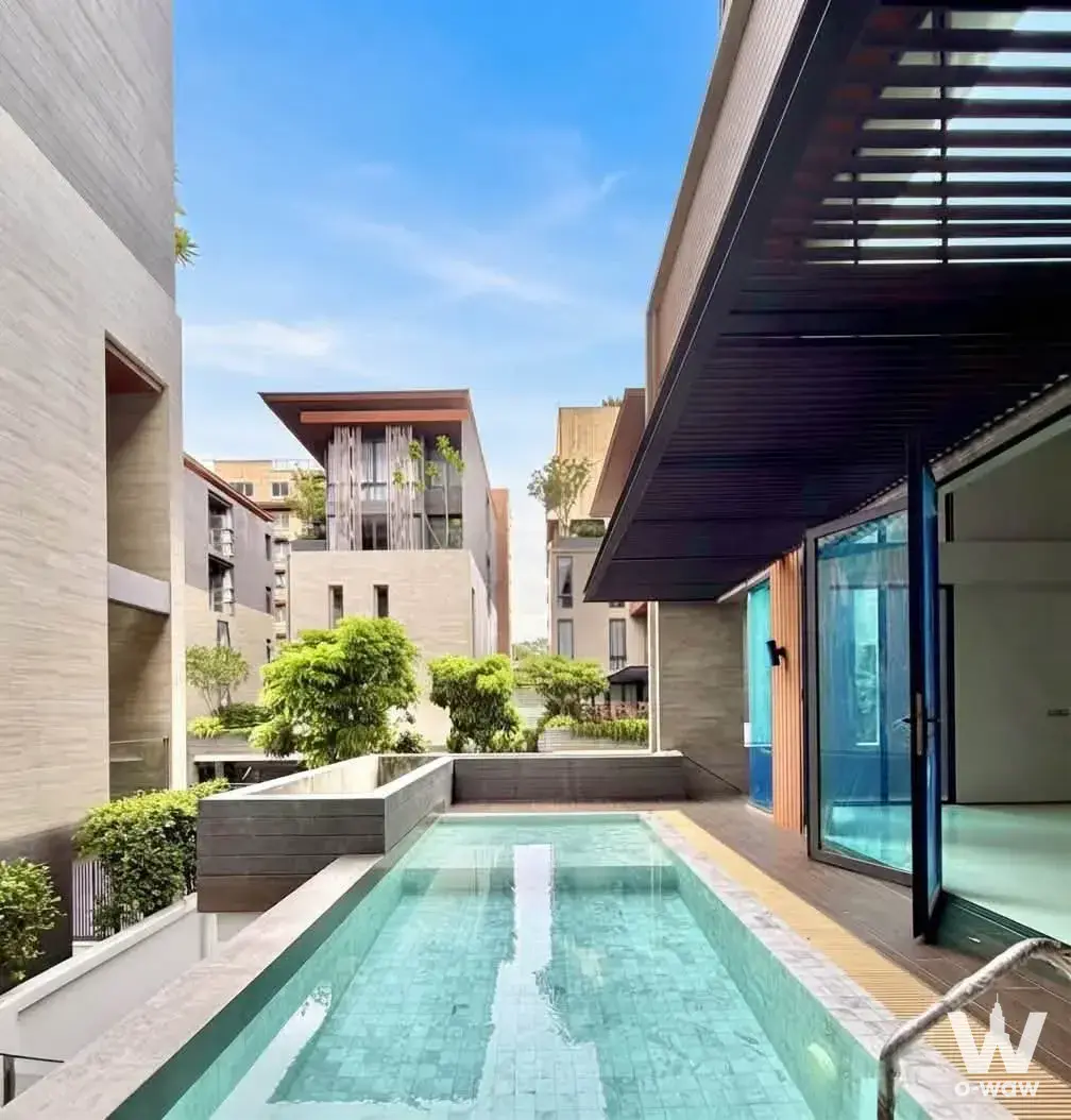 Villa Sathorn 4-bed condo for sale has a courtyard with lap pool and glass doors