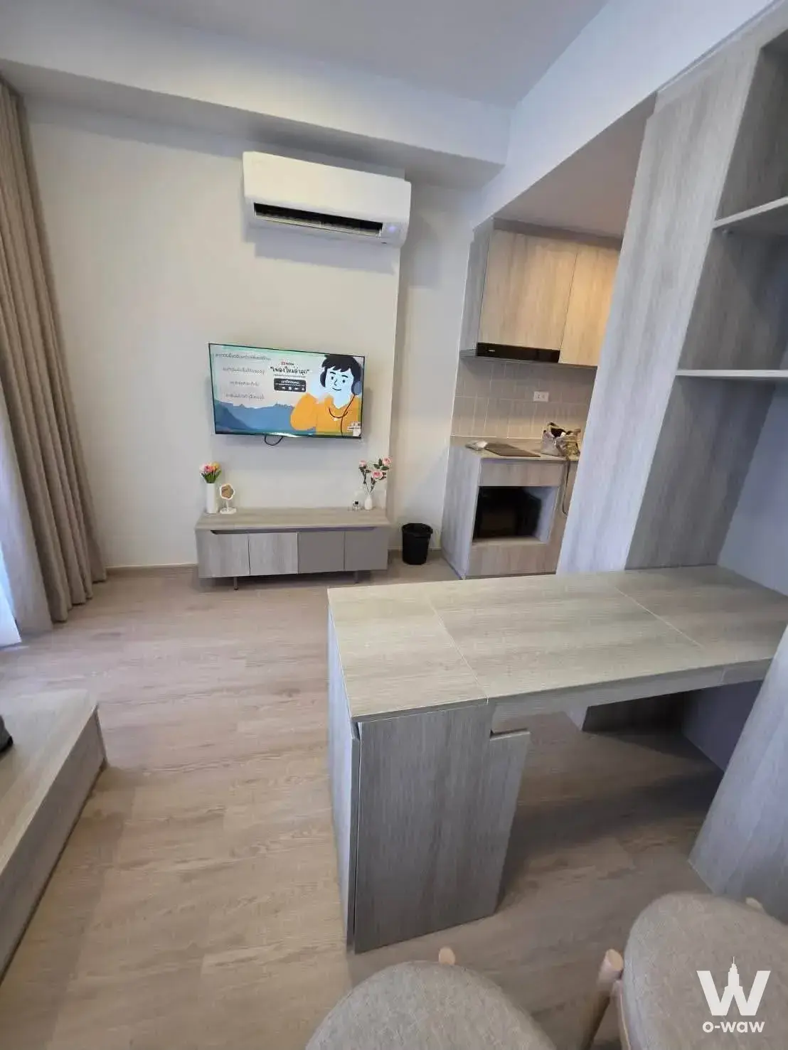 Compact kitchenette and desk setup in a 1-bed COBE Kaset-Sripatum studio