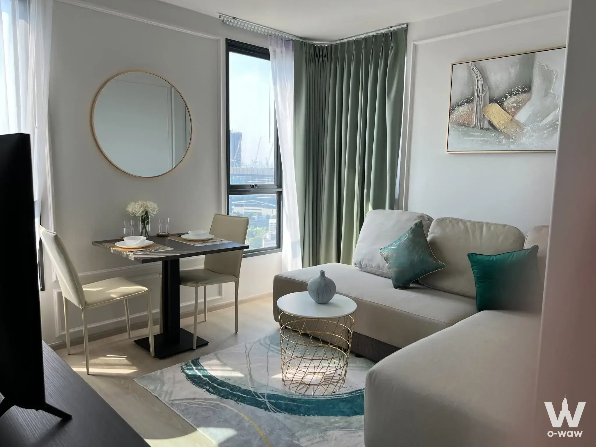 1-bed condo for rent in ELIO DEL NEST featuring teal accents, city skyline view, and modern dining nook