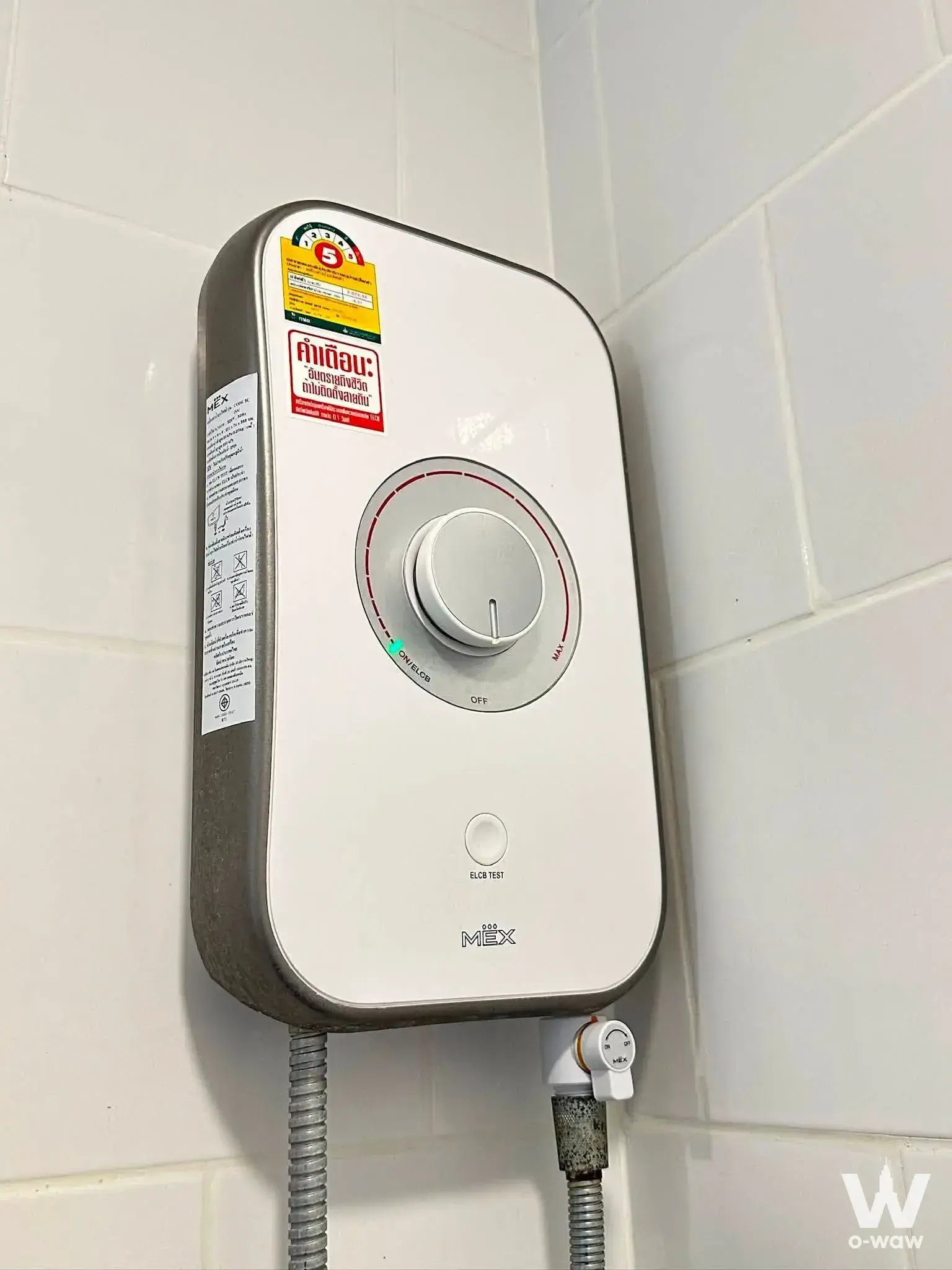 Bathroom wall showing an electric water heater on white subway tiles in Notting Hill Charoen Krung 93