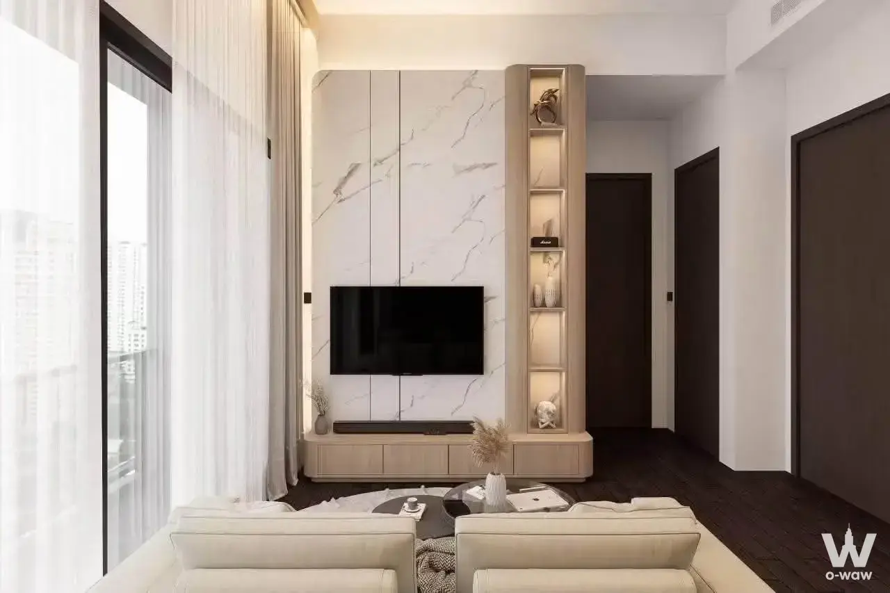 Cream sectional sofa and marble feature wall in Park Origin Thonglor 2-bed condo