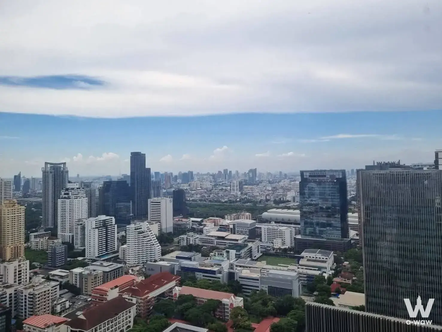 Midtown of Asoke road (Soi Sukhumvit 21), between BTS Asoke and MRT Petchburi
