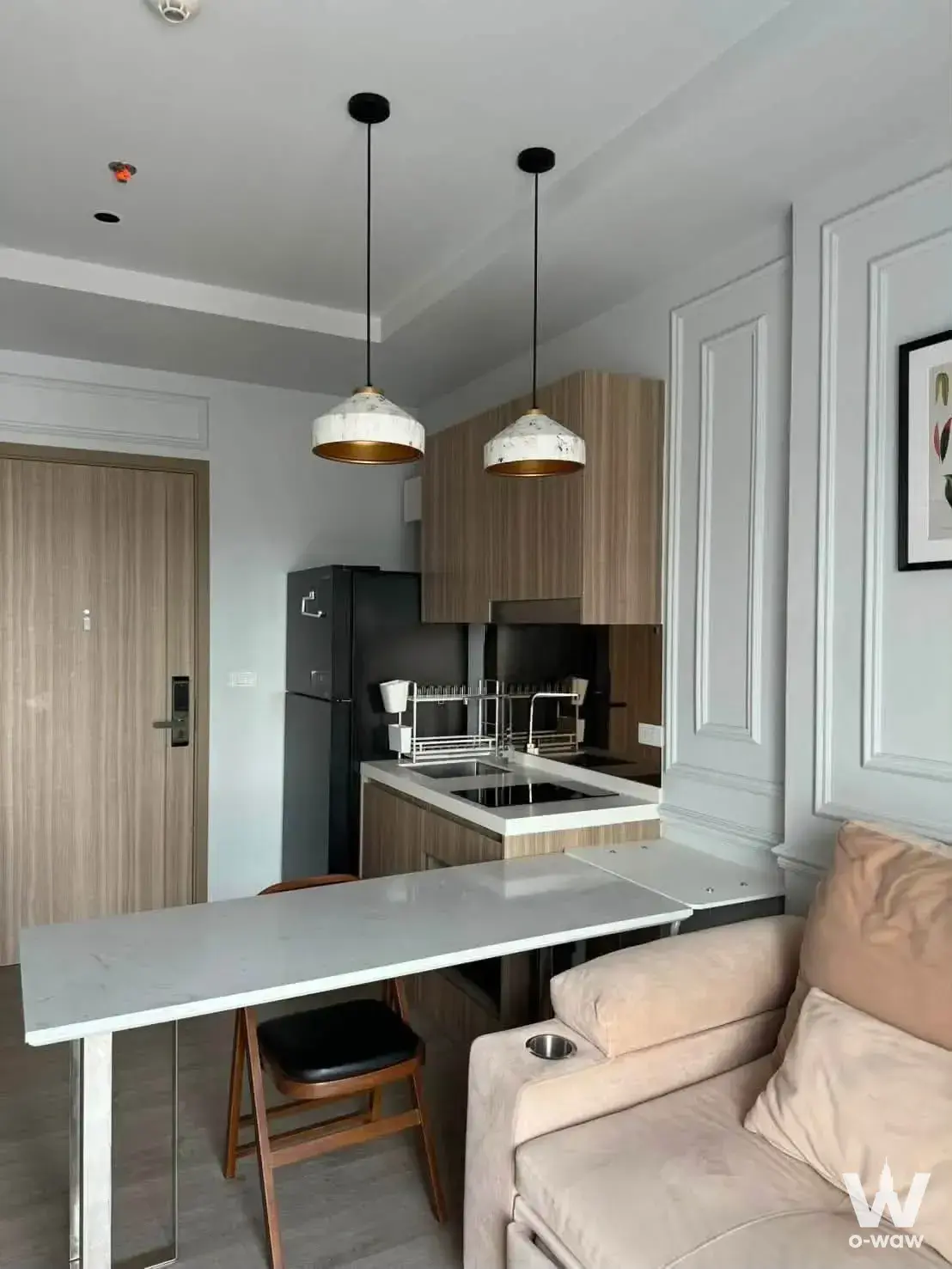 1-bed condo for rent in Altitude Unicorn-Tha Phra with open-plan kitchen and gold-accent pendant lights