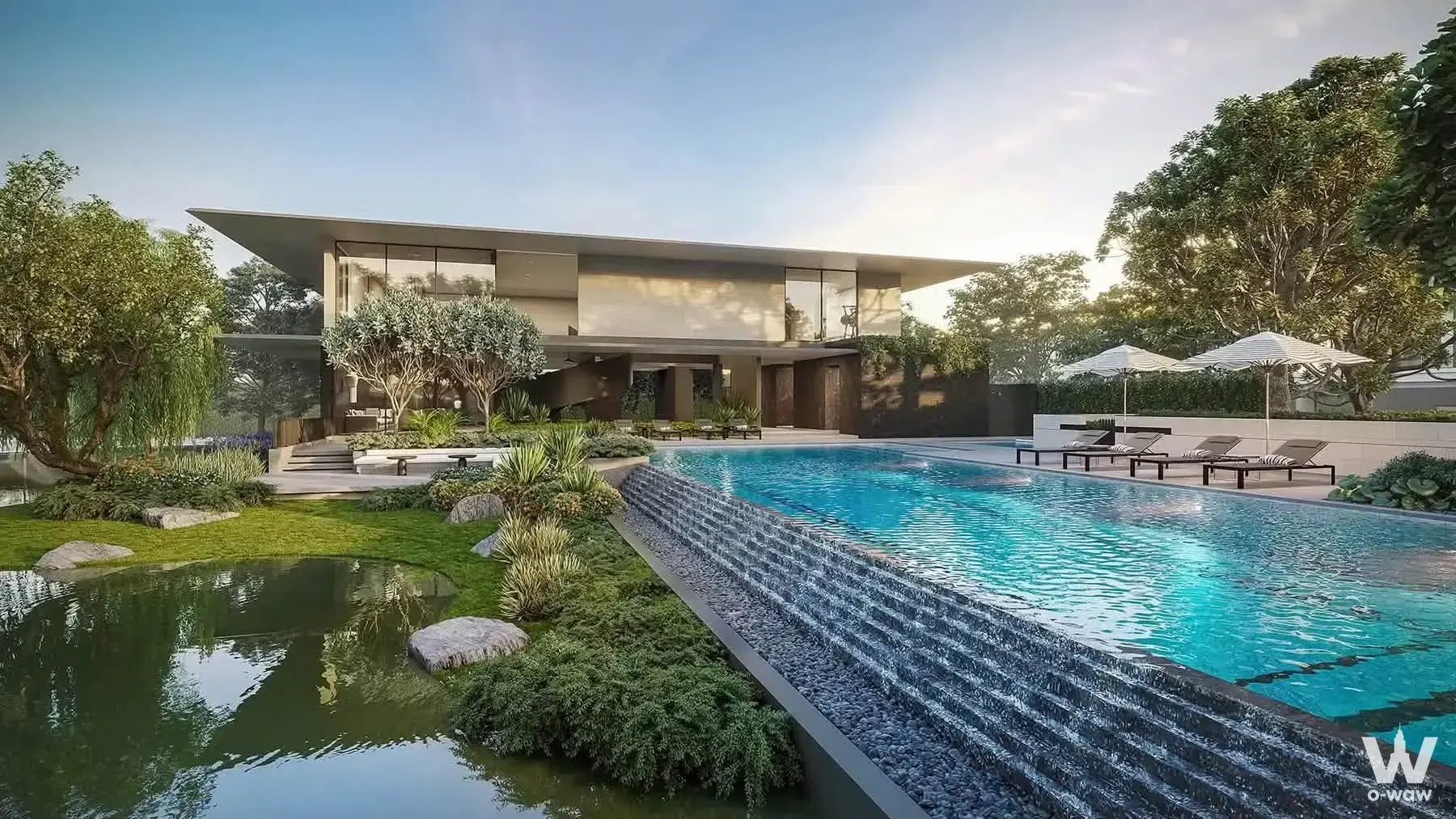 This modern 5-bed house for sale at Setthasiri Great Don Mueang has an infinity pool, stone waterfall and landscaped lawn