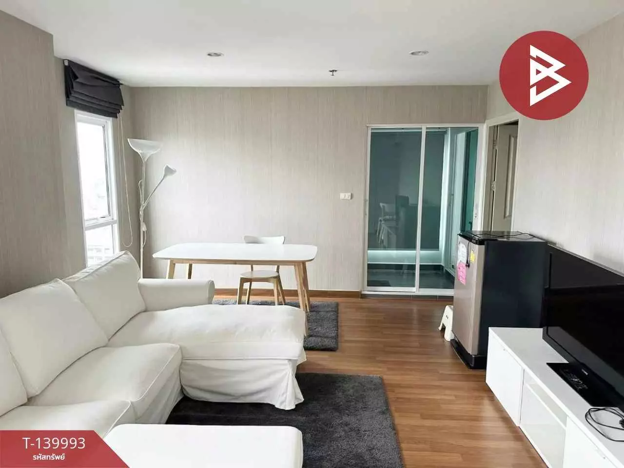 Modern living room in 2-bed condo for sale at Regent Home Bangson 27 with white sectional sofa and wood floors