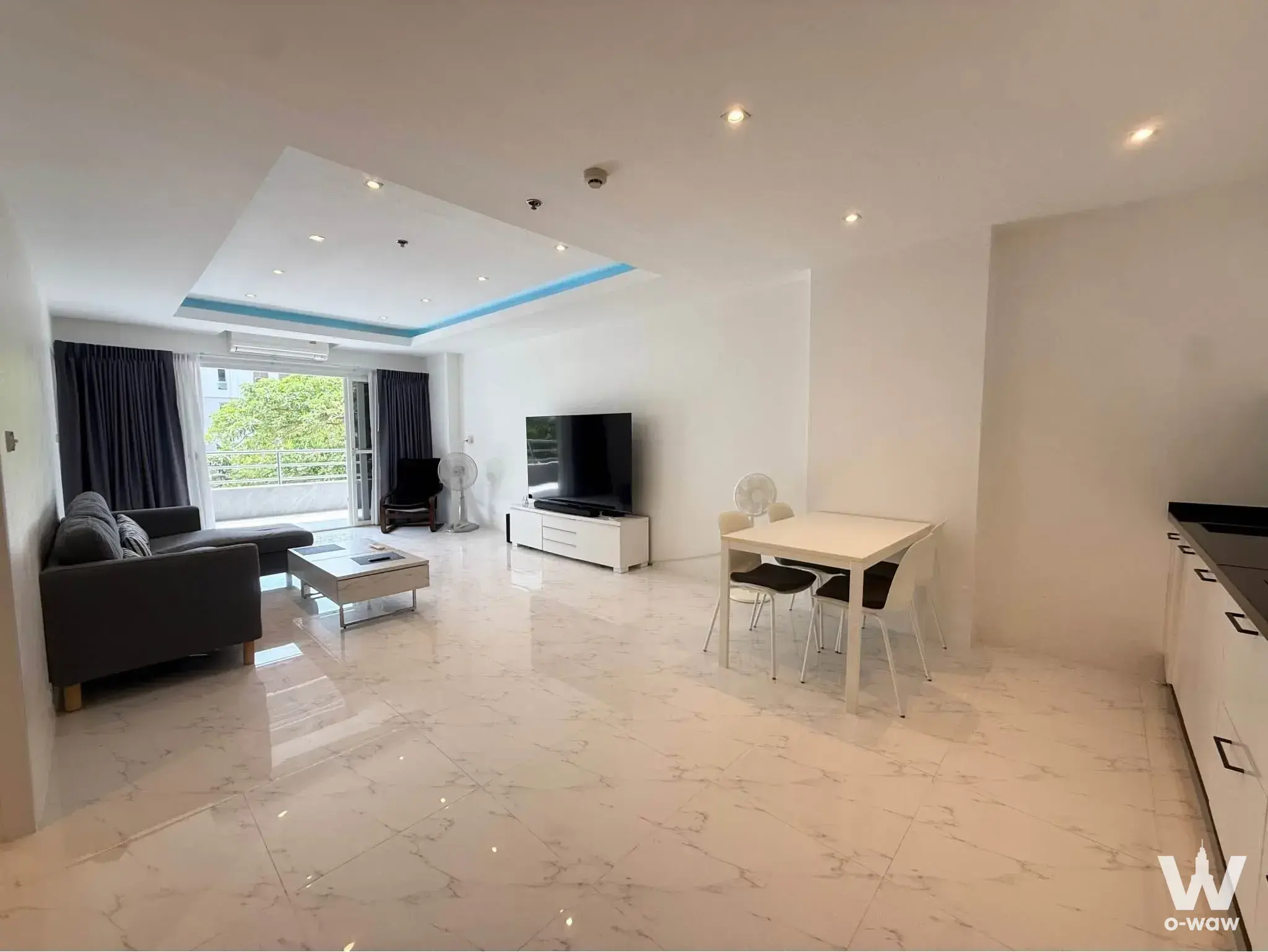 2-bed condo for sale in View Talay Condo 3A with open-plan living, glossy marble floors, and balcony views
