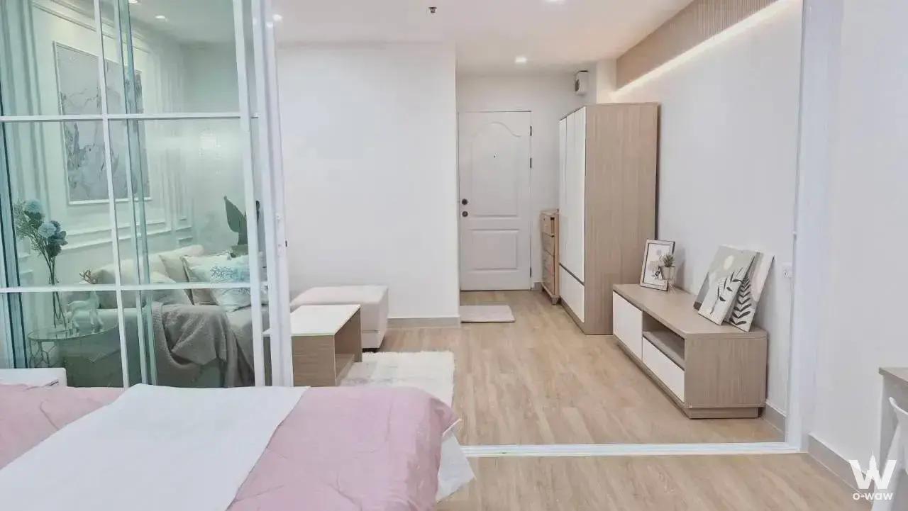 1-bed condo studio for sale in Regent Home 1 with glass partition, warm LED lighting, and tidy decor