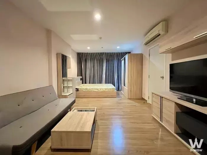 Modern 1-bed studio for rent in The Tree Interchange with light oak flooring and grey upholstered bench