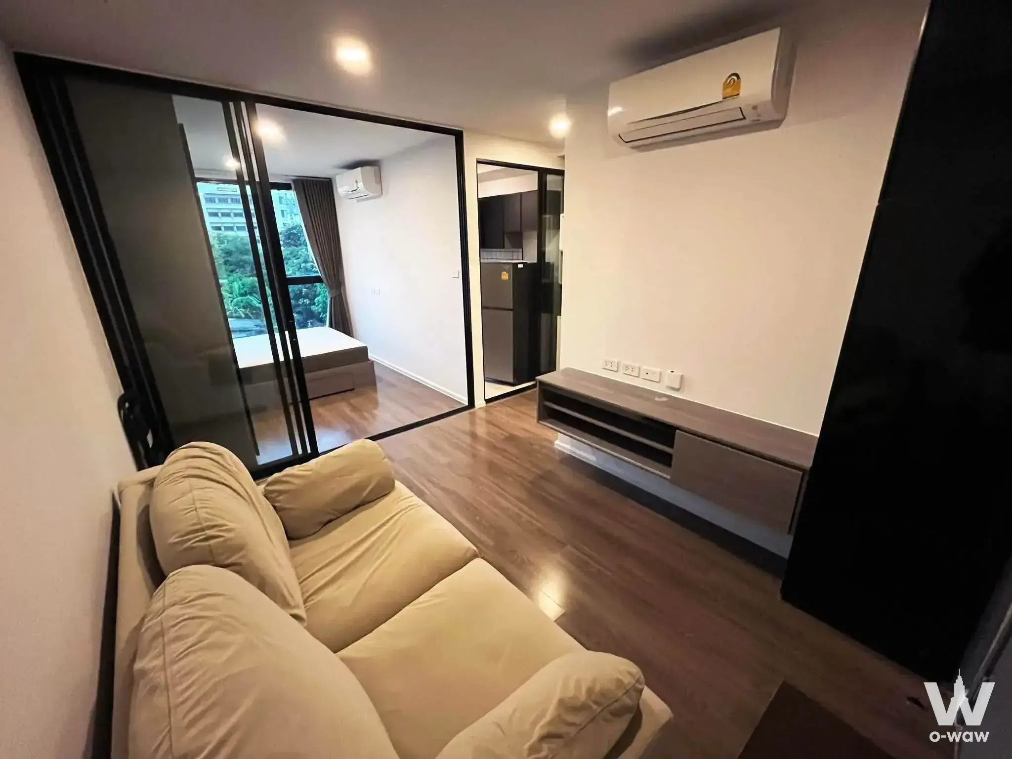 Living room with glass partition bedroom at The Origin Ratchada-Lat Phrao