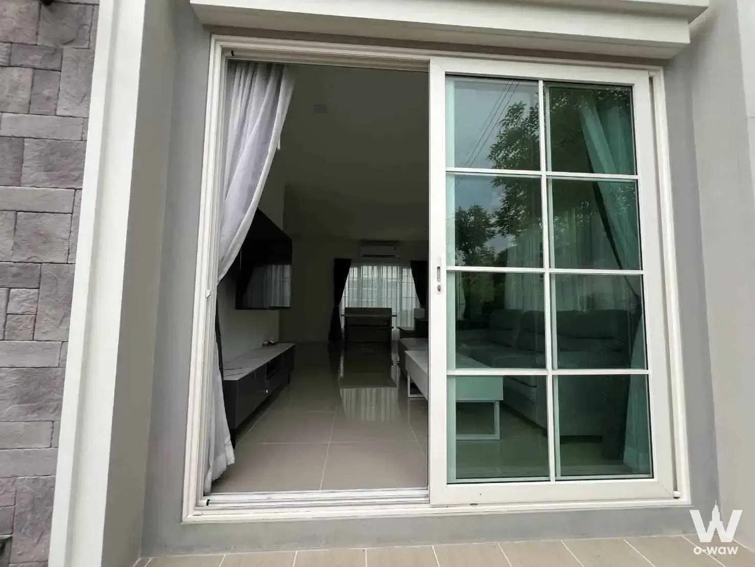Prestige Future-Rangsit 4-bed condo exterior modern facade with stone veneer and glass doors
