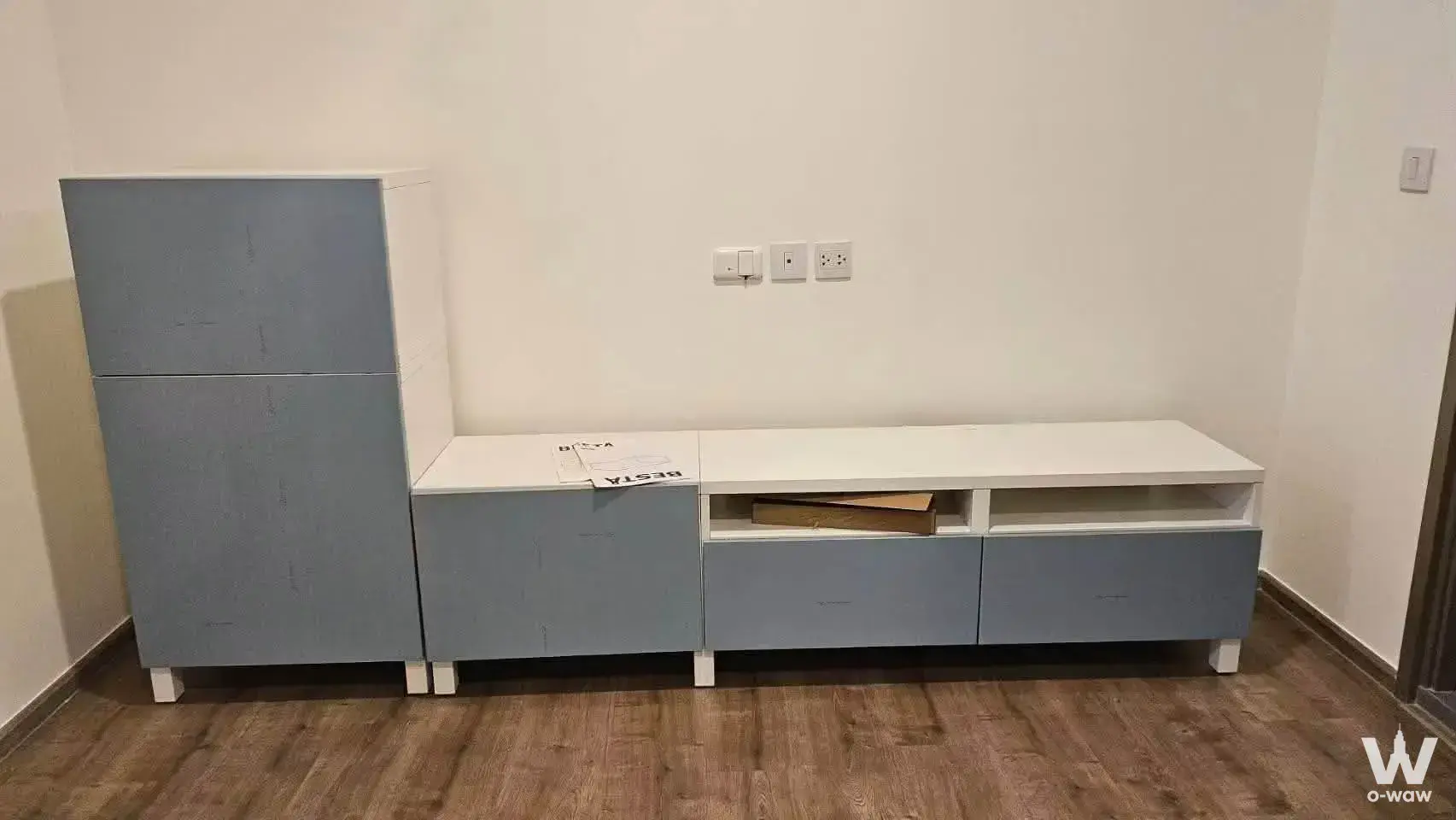 Minimalist storage area in Aspire Pinklao - Arunammarin condo with blue-grey modular unit and wood-look flooring