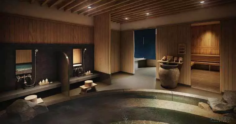 Luxury onsen spa bath in Runesu Thonglor 5 condo with stone soaking pool and wood panel walls