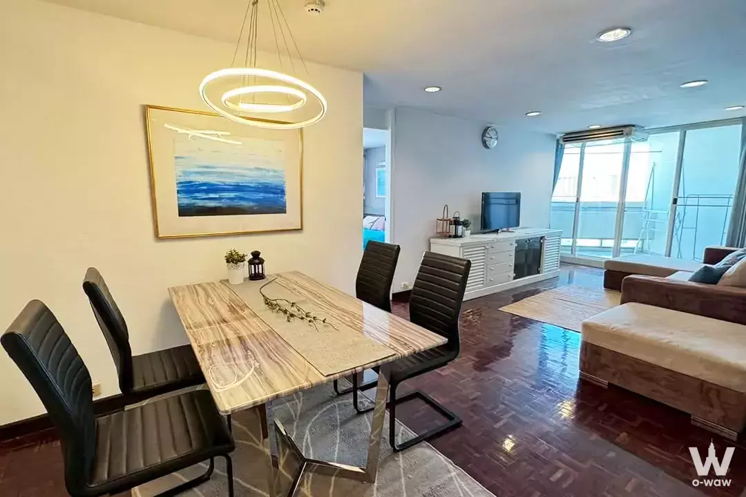 Dining area in Tai Ping Towers 2-bed condo for sale featuring marble table and LED pendant light