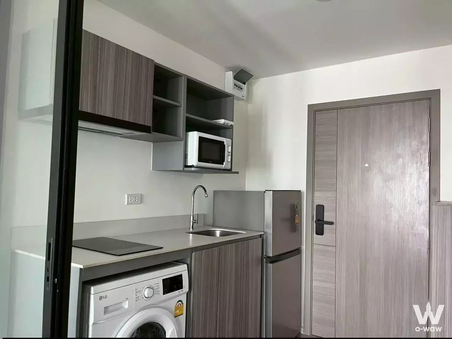 Compact 1-bed condo for rent in The Station Condo with integrated kitchenette and neutral palette