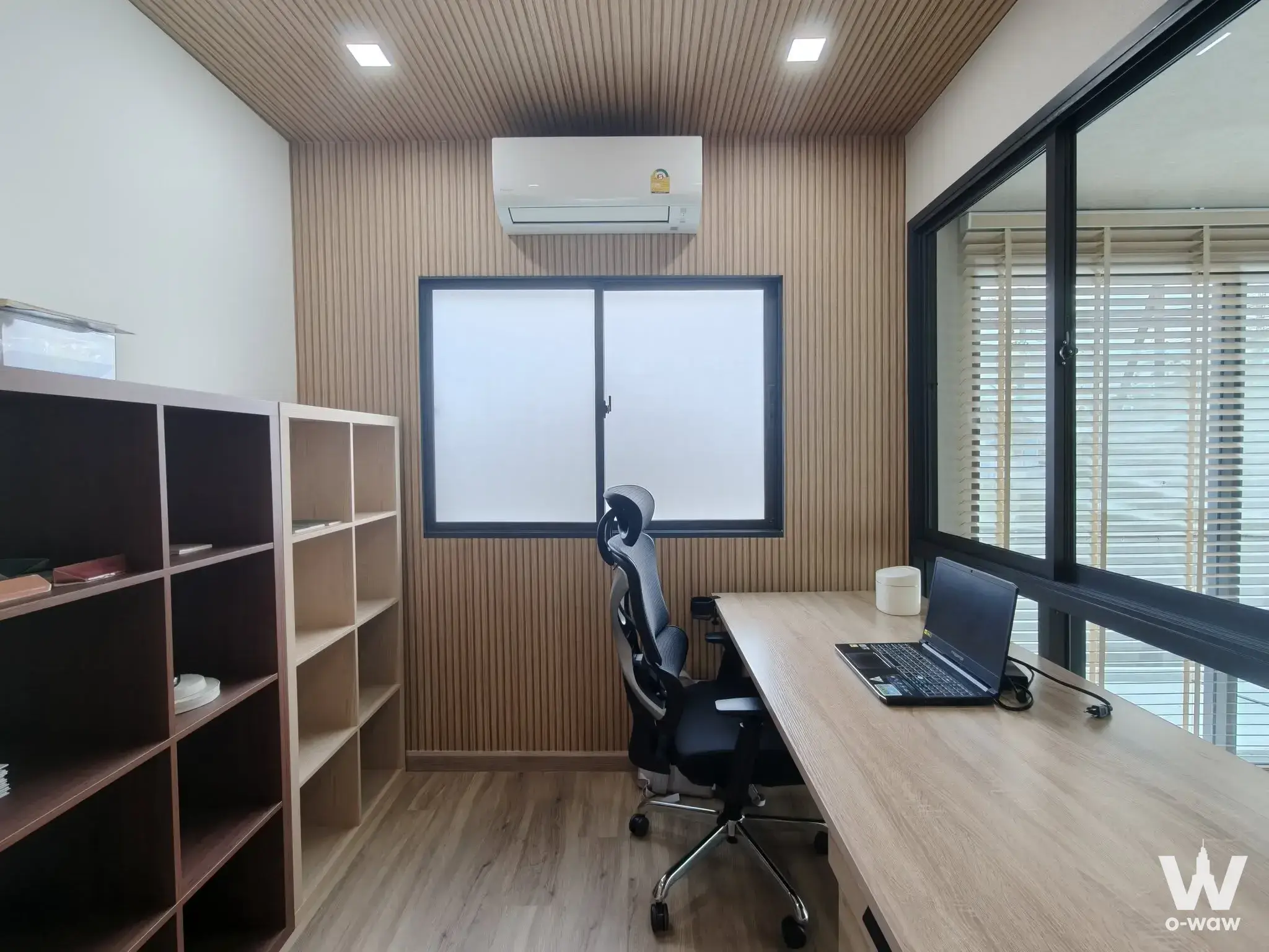 Pruksa Ville townhouse home office with wood-slat walls, desk, and ergonomic chair