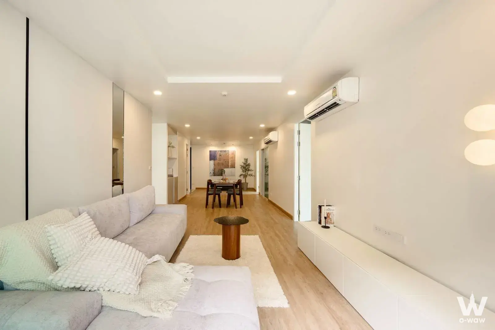 3-bed condo for sale in Voque Sukumvit 31 with open-plan living area and L-shaped sofa