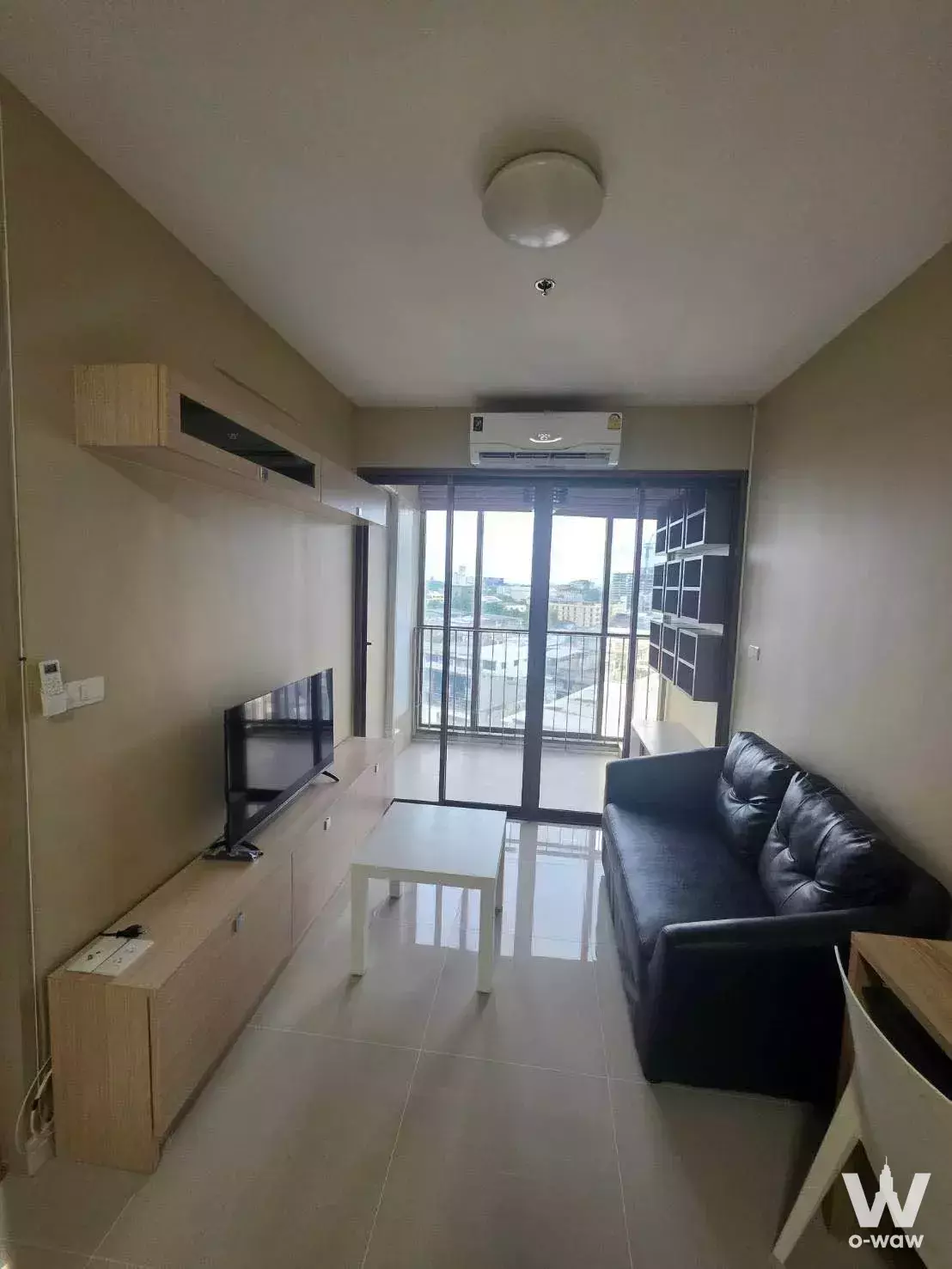 1-bed condo for rent in Ideo Mix Sukhumvit 103 with balcony city view and modern living room