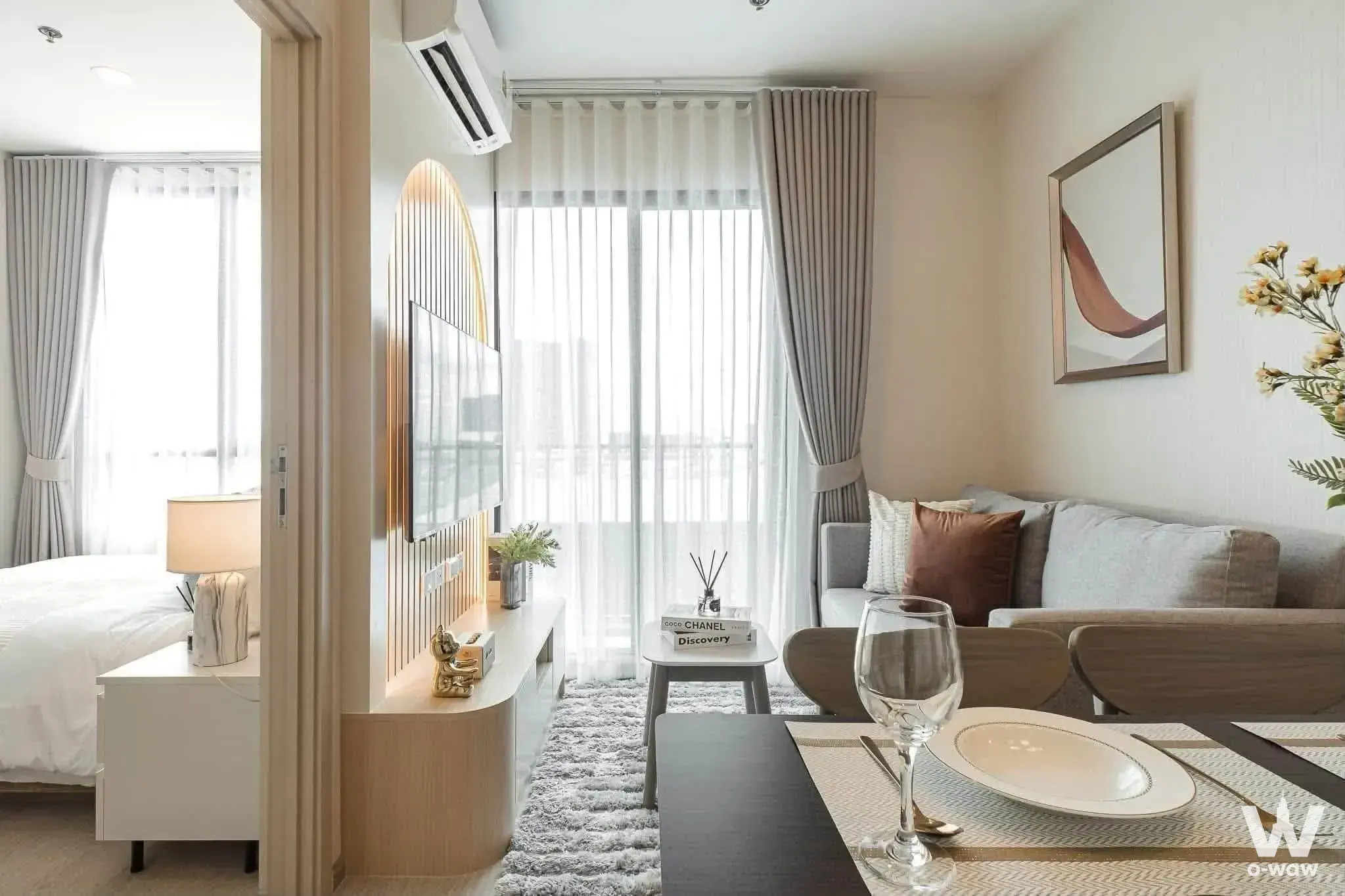 NUE Noble Faichai Wang Lang 2-bed condo living area with wood slat TV wall