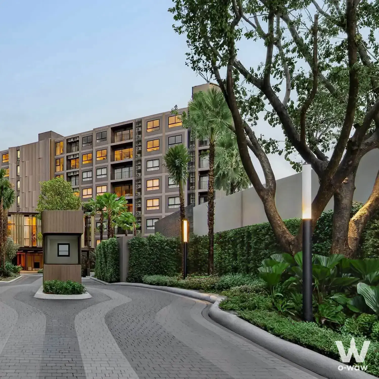 Luxury condo exterior with wood slats and palm trees at The Base Cherngtalay
