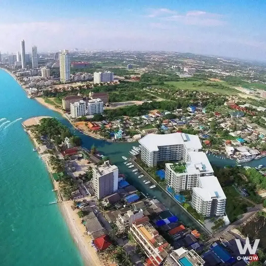 Whale Marina Condo 1-bed for sale with aerial views of turquoise ocean, marina boats, and modern high-rise towers