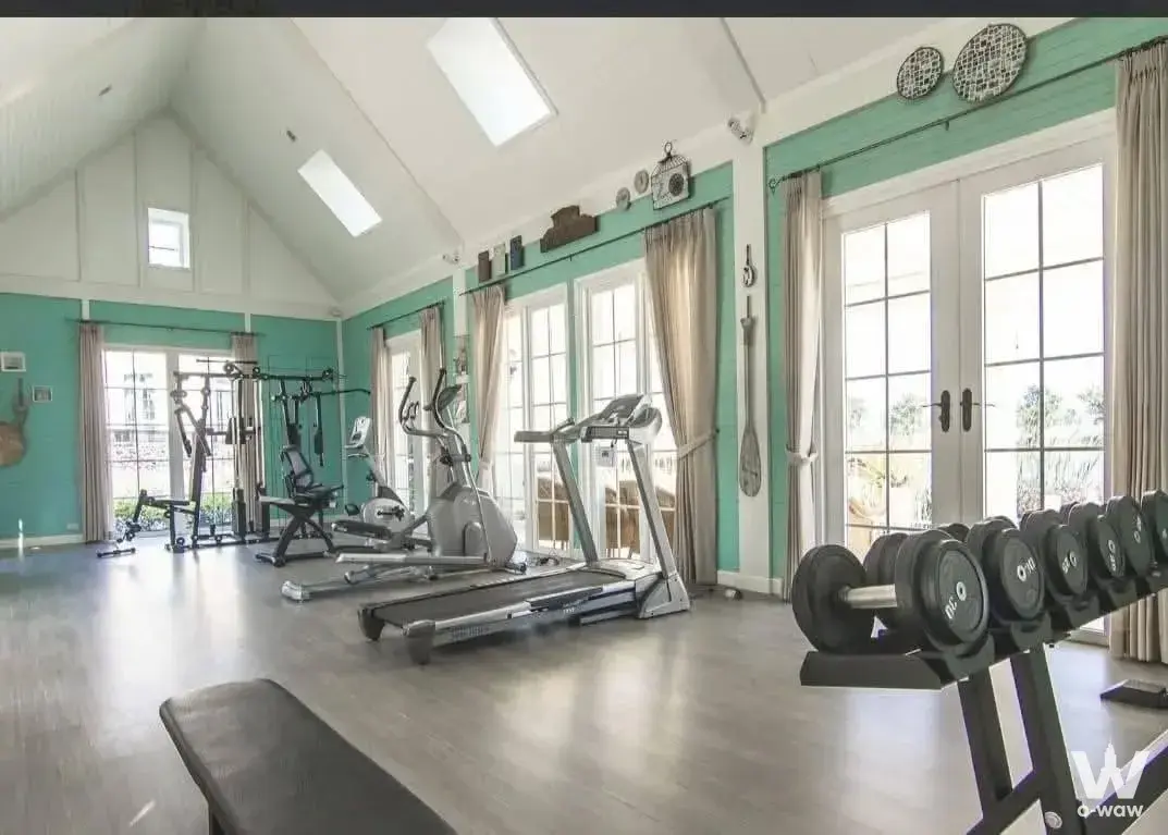 Home gym with treadmill and weight bench in Villaggio Bangna 4-bed townhouse