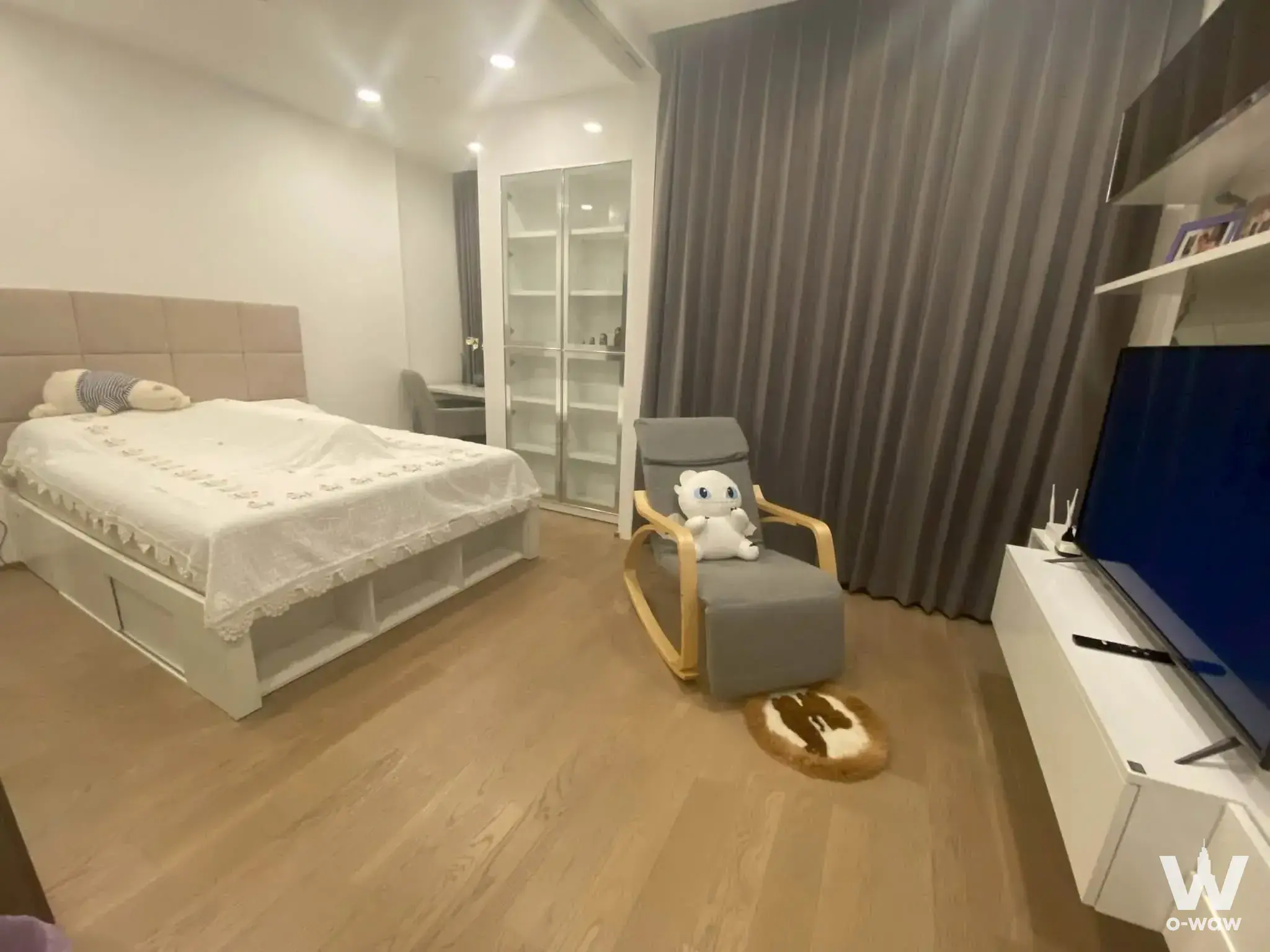 Ashton Chula-Silom 1-bed condo bedroom studio with queen bed, under-bed storage, TV unit, and neutral modern furnishings