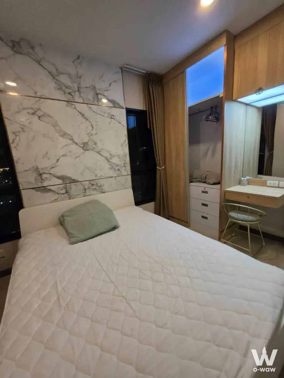 The Tree Sukhumvit 71-Ekamai two-bedroom suite with marble feature wall, wardrobe, and vanity desk