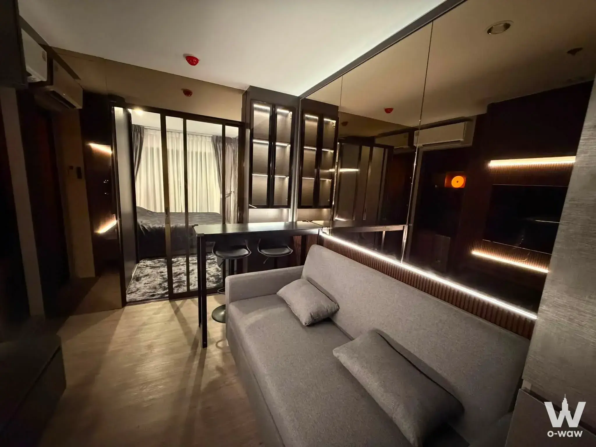 Regent Home Wutthakat 1-bed condo with mirrored wall, LED lighting, and modern furnished layout