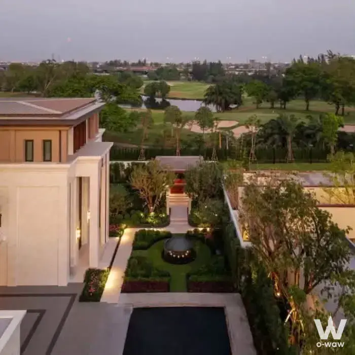 Luxury villa exterior with pool and golf course view at Cinq Royal Bangna