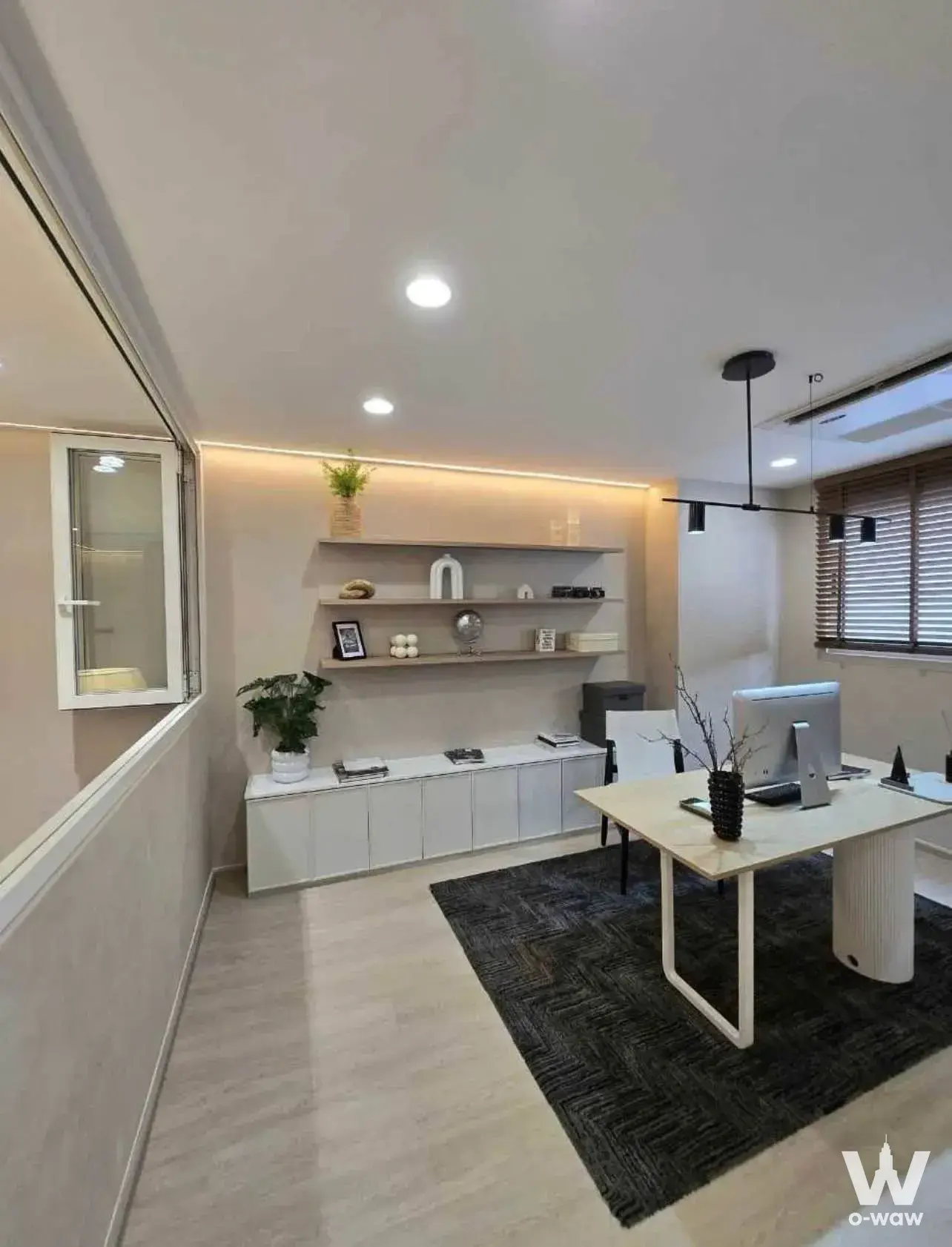 Minimalist home office with floating shelves and desk in a 3-bed Nue Verse townhouse
