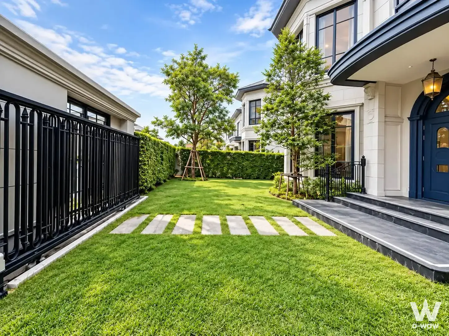 Luxury 4-bed house for sale in Narasiri Krungthep Kreetha with navy arched door and manicured lawn