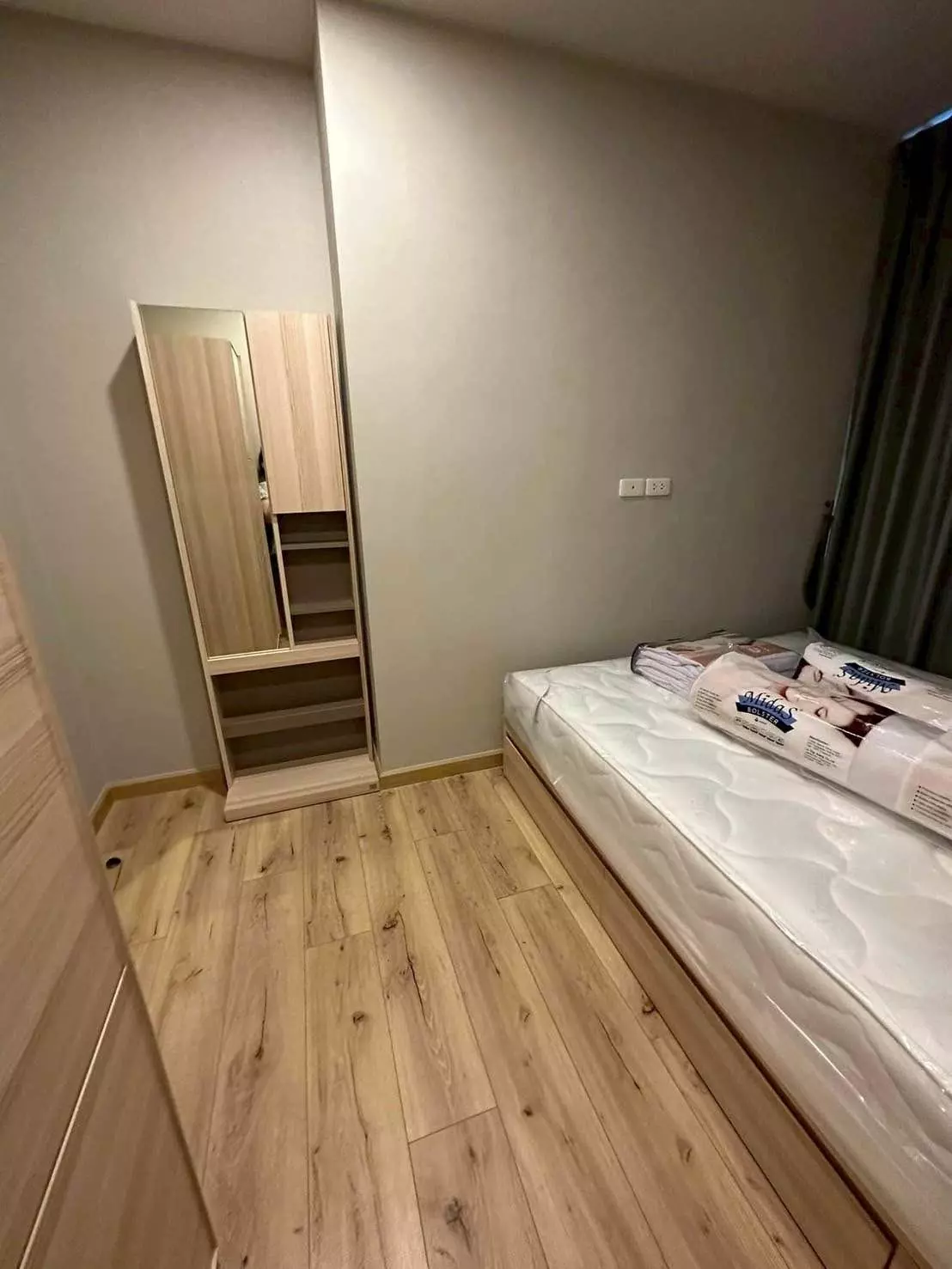 Compact bedroom in Brix Condominium Charan 64 with new Sofia mattress and tall wardrobe unit