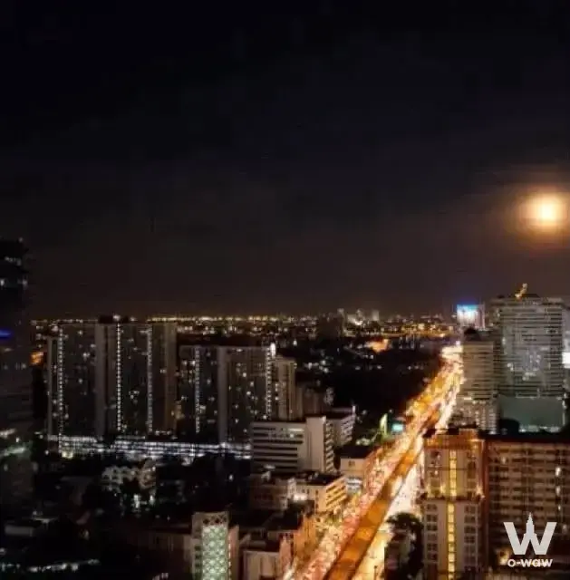 Night cityscape view from high-floor 1-bed condo for sale in Condolette Midst Rama 9