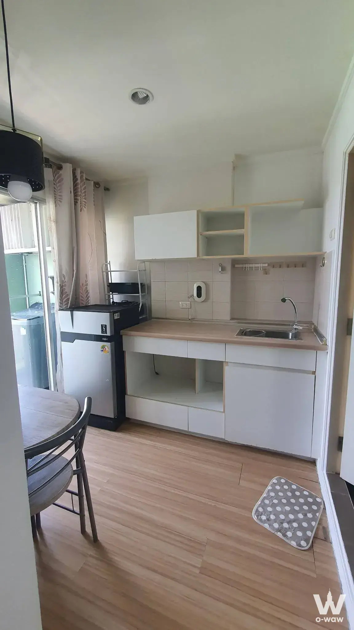 1-bed condo for sale in Lumpini Ville Phatthanakan kitchenette with light wood countertop and stainless steel sink