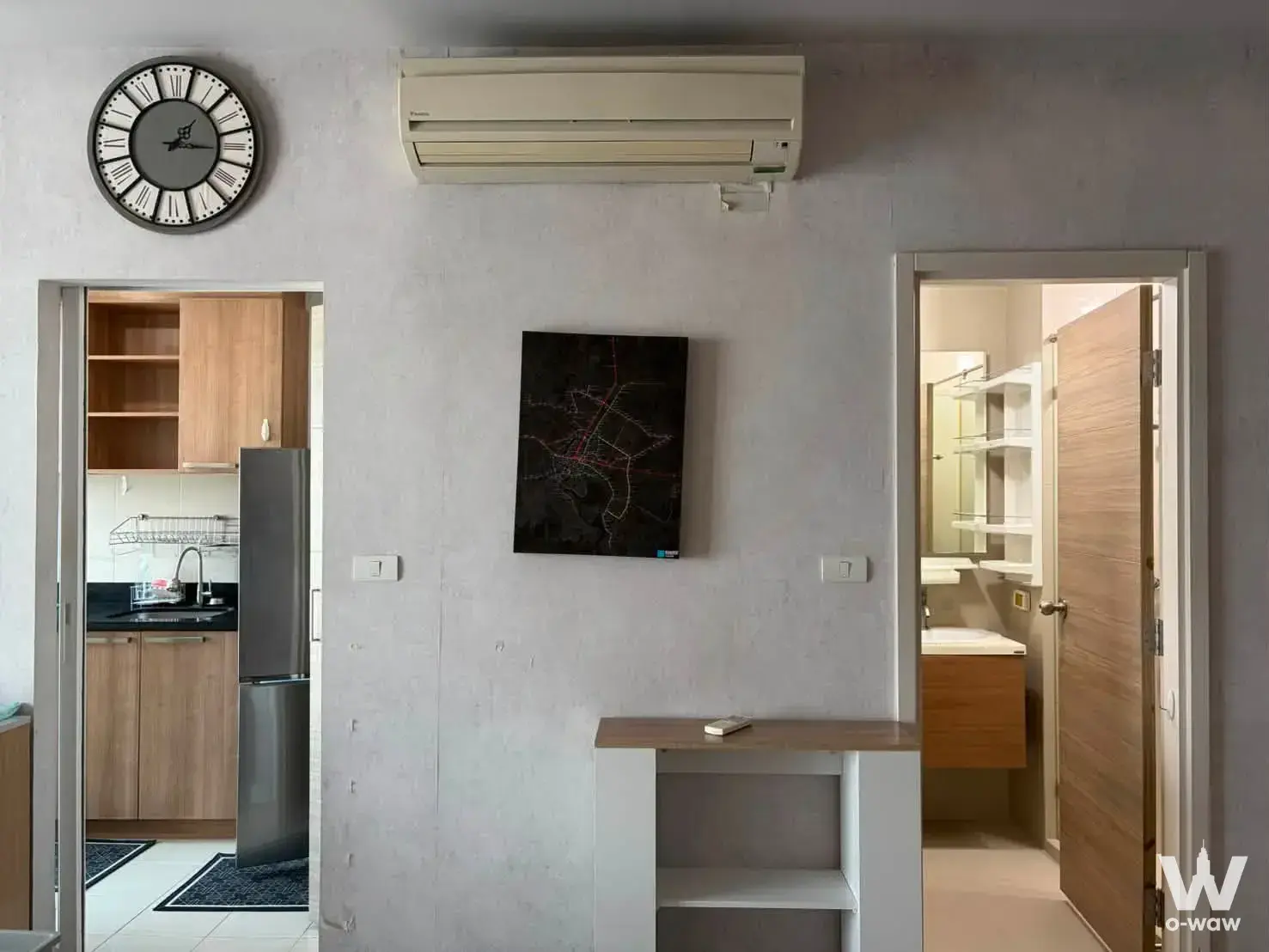 Open living area with kitchen and bathroom views in this Hive Taksin two-bedroom condominium