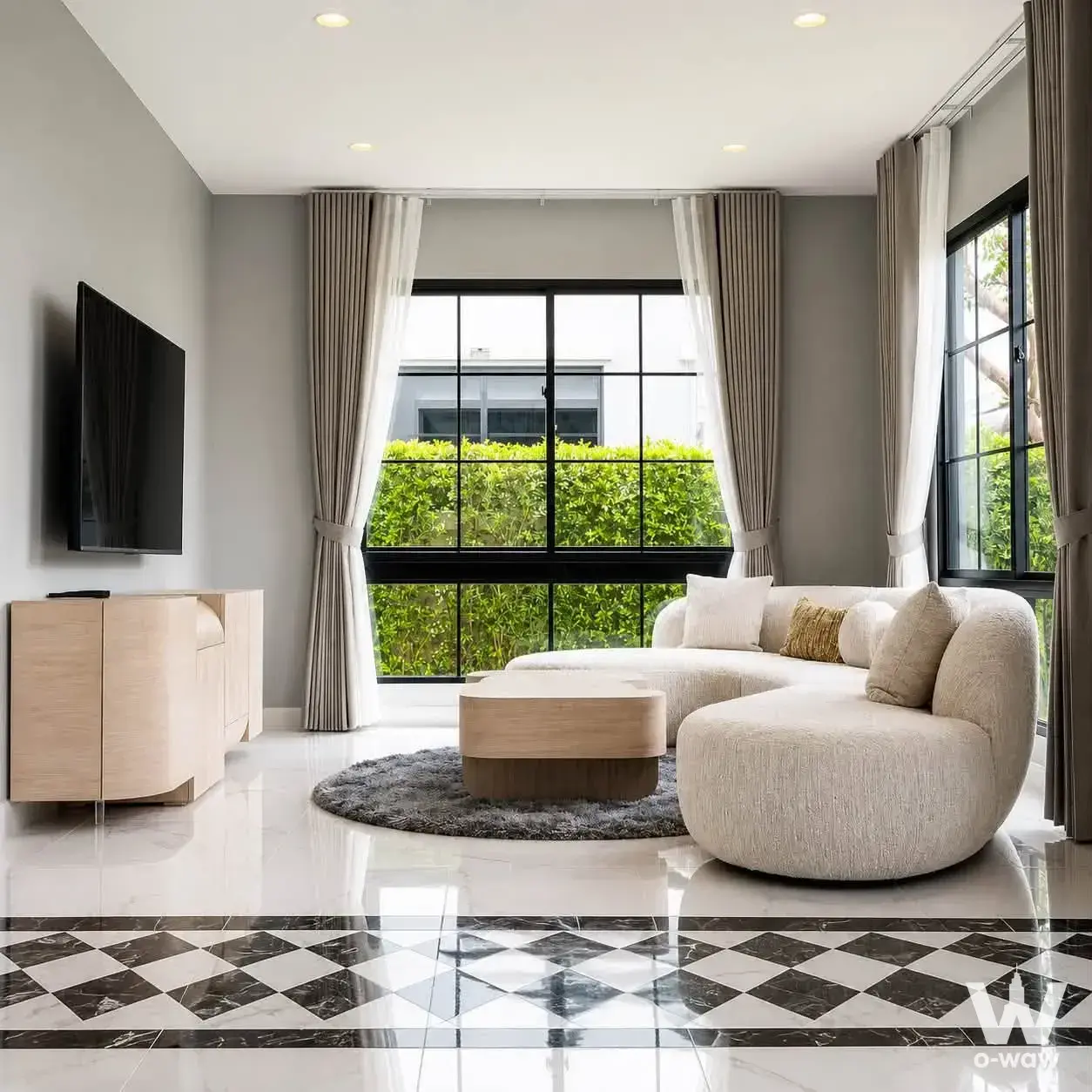 Modern living room with cream boucle sectional sofa and marble floors for rent in Don Mueang house