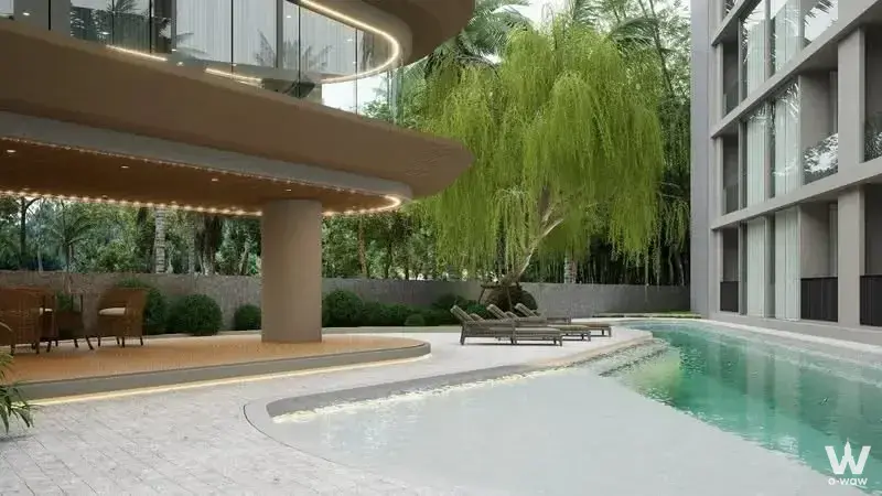 Curved turquoise pool and wicker dining set under pavilion at Secret Garden Condominium