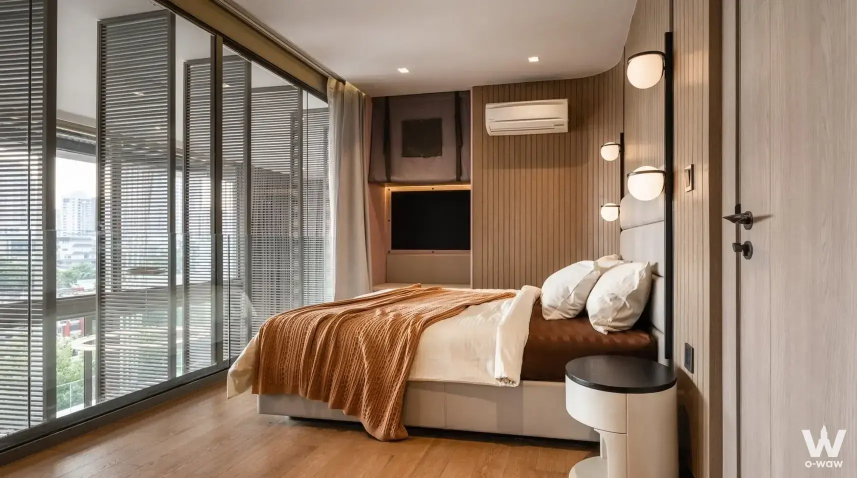 Fynn Sukhumvit 31 master bedroom with wood slat wall and city view