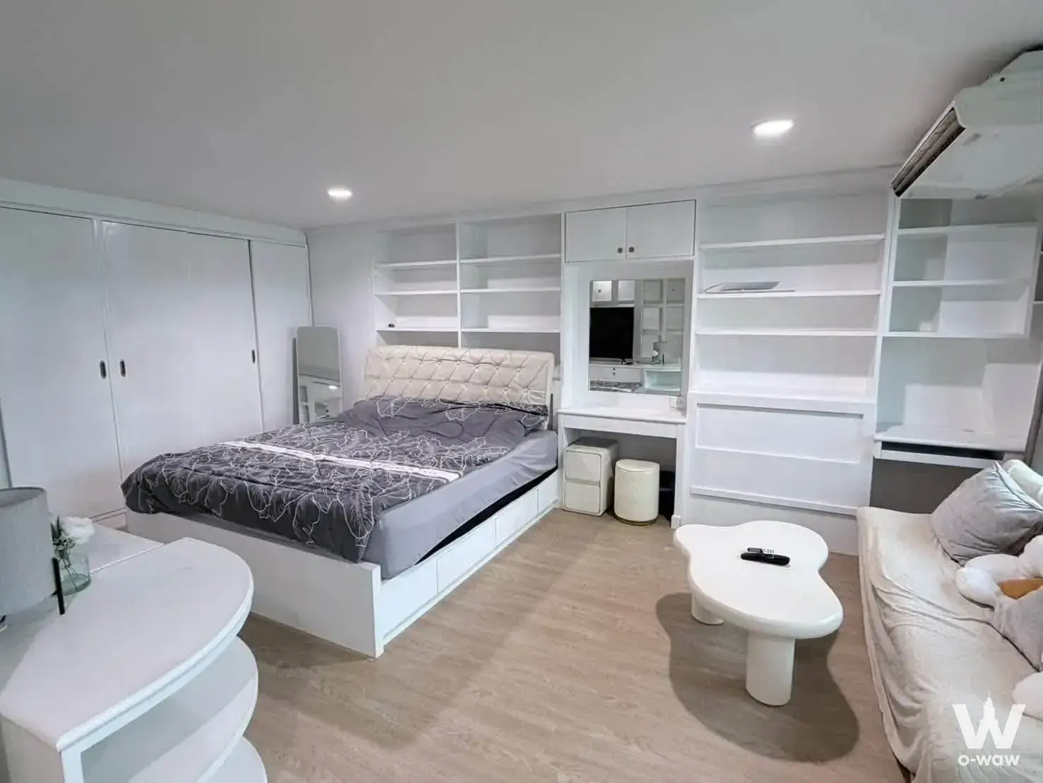 Furnished bedroom in a Silom Condominium 2-bed rental featuring a queen bed and integrated vanity desk