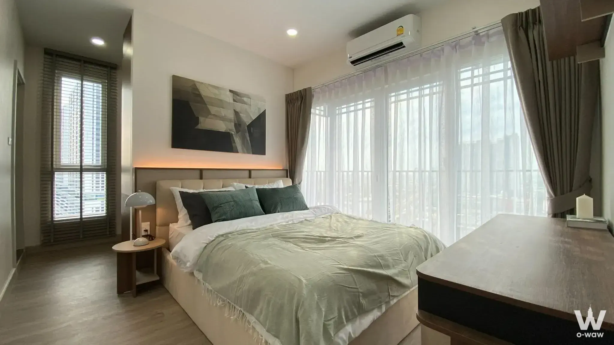 2-bed condo for rent in Supalai Loft Phasi Charoen Station master bedroom featuring LED headboard and city views