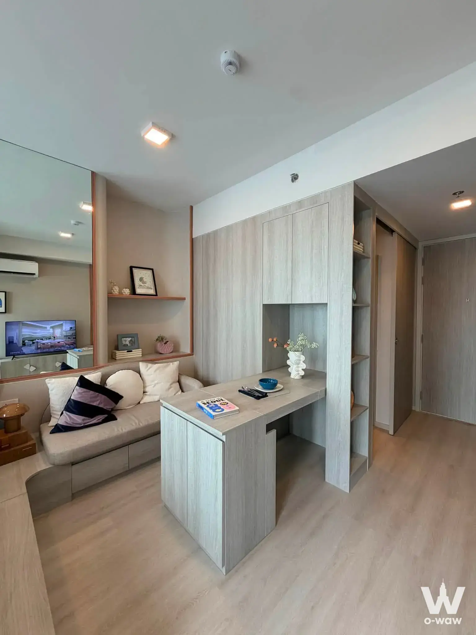 Studio living room in COBE Ratchada-Rama 9 with built-in desk and large mirror