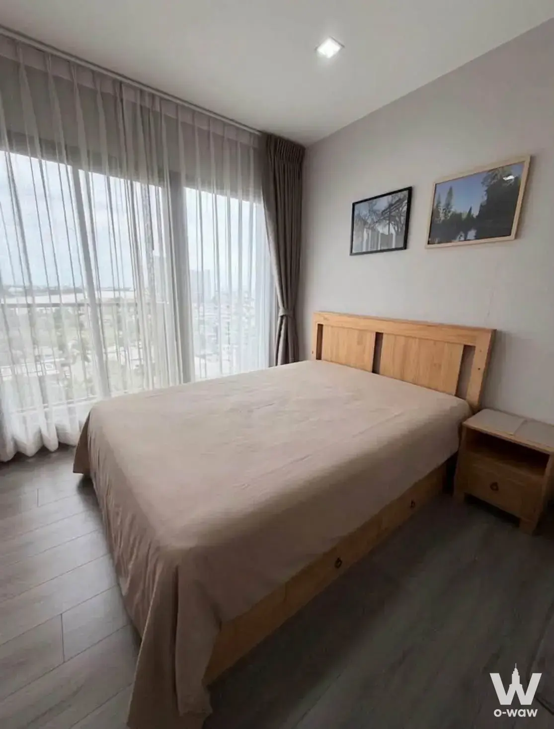 Furnished bedroom with city view in a 1-bed condo for rent at The Politan Aqua