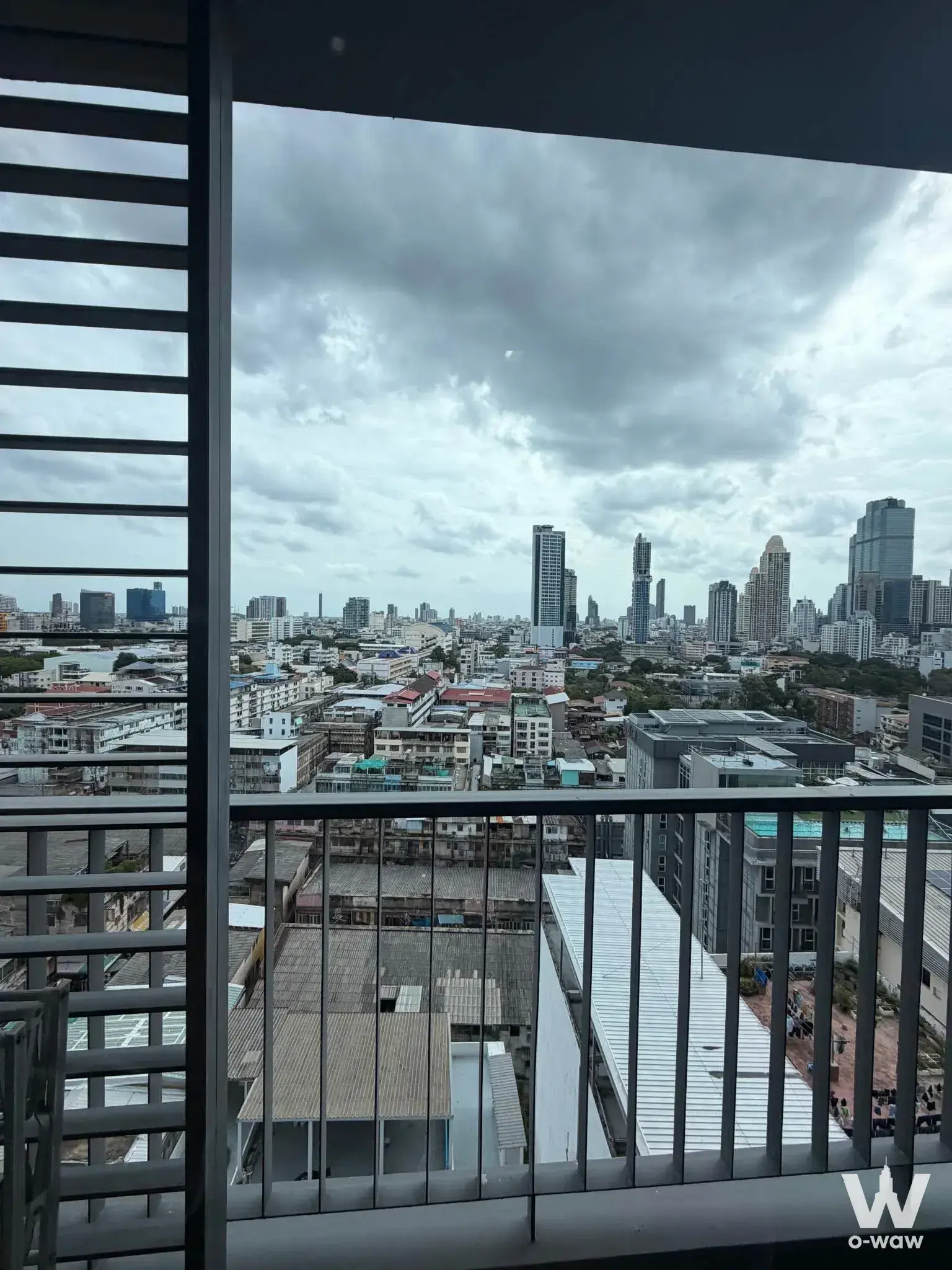 High-floor balcony view of Bangkok skyline from 1-bed condo for rent in The Seed Mingle, Suanplu