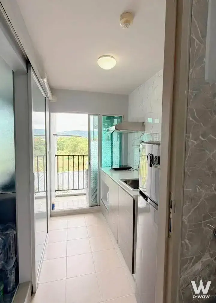 1-bed condo for sale in dcondo mine Phuket with galley kitchen and balcony access
