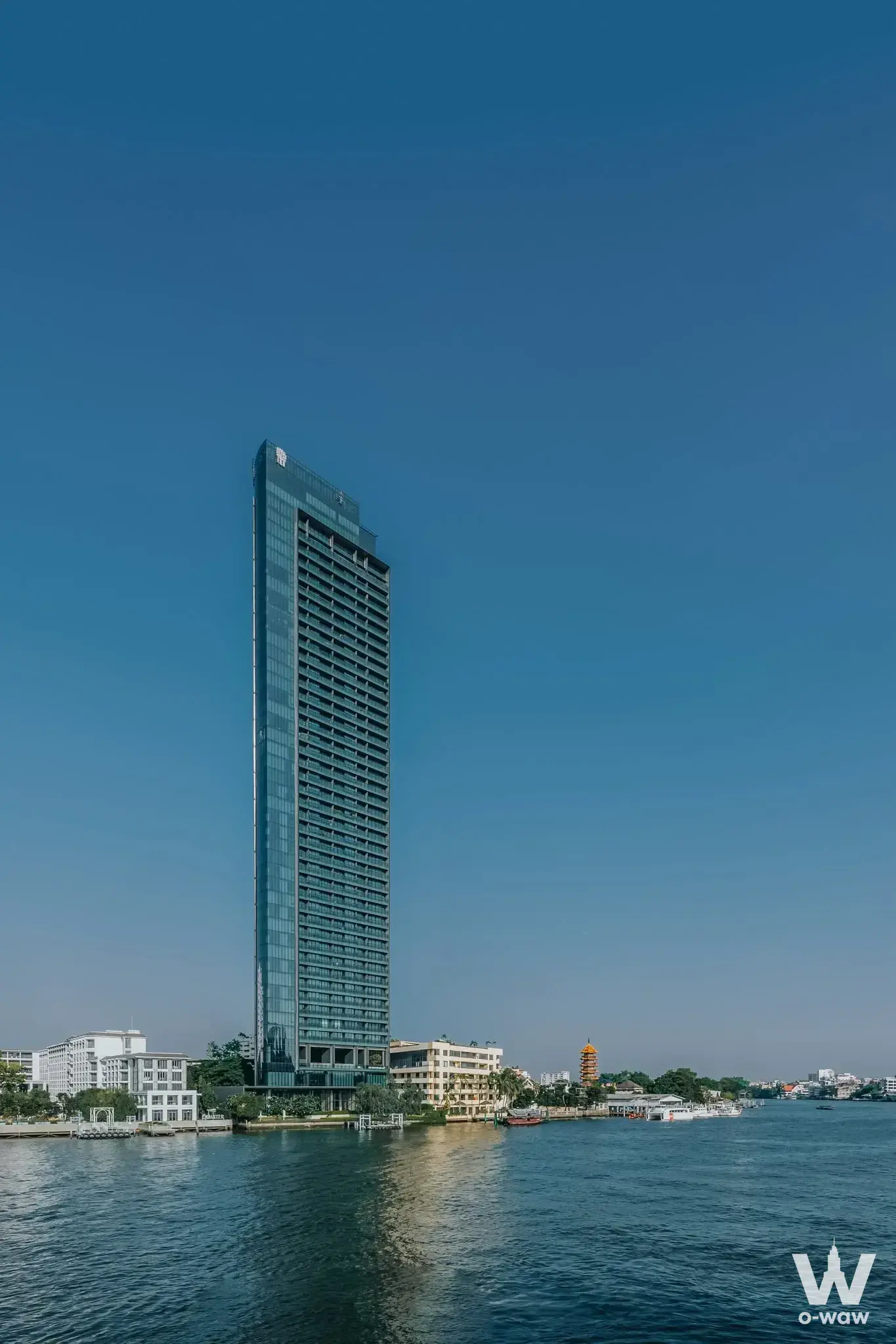 Banyan Tree Residences Riverside Bangkok exterior with river view and pagoda spire